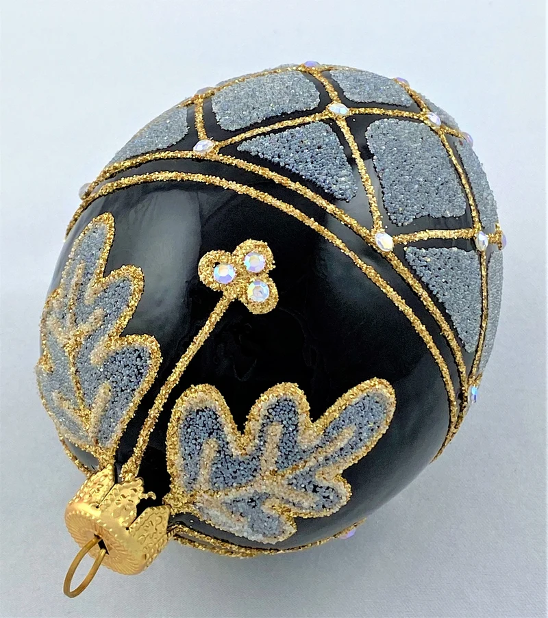 Ei-Form schwarz mit gold/beige Dekor