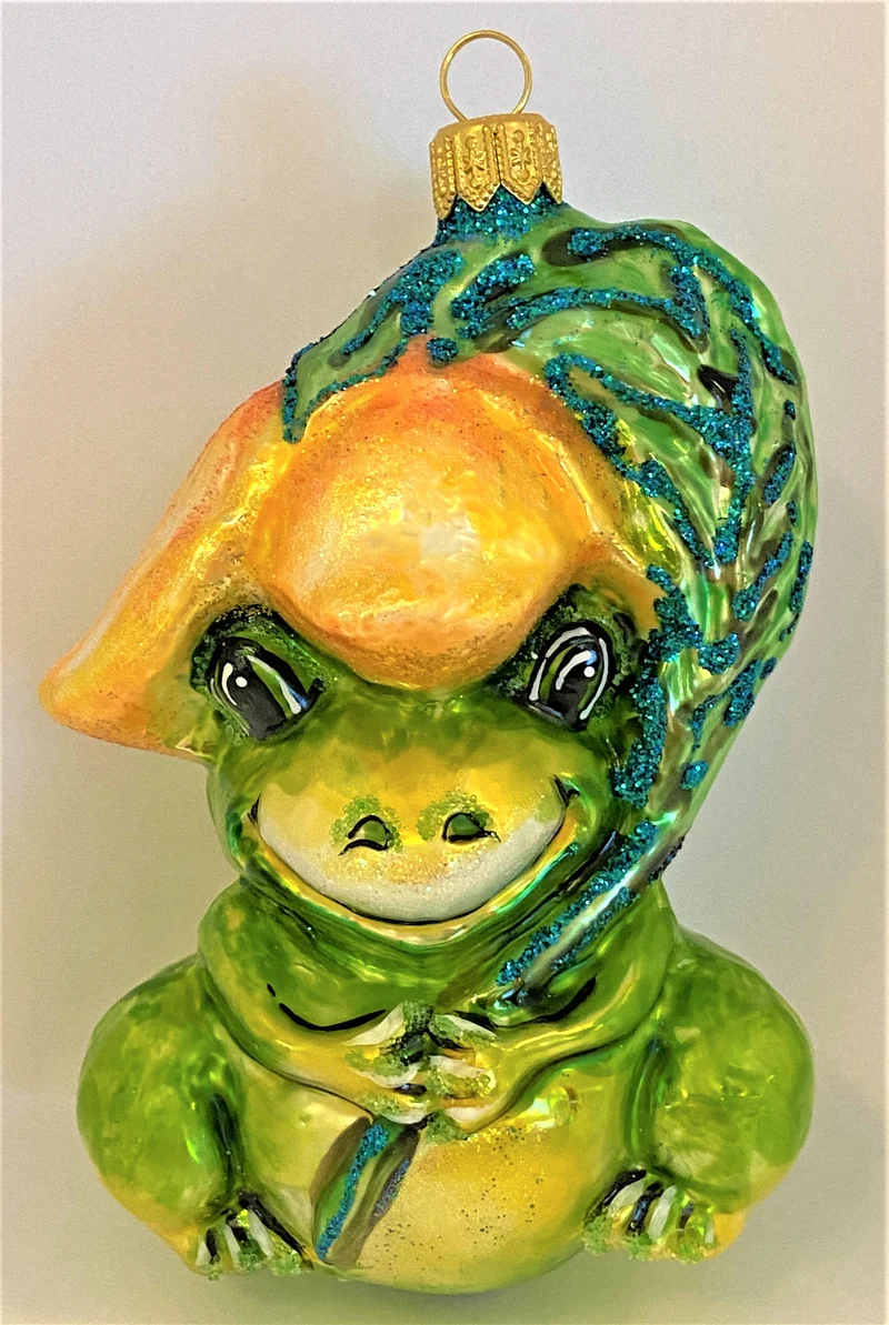 Fröhlicher Frosch unter Blütenranke