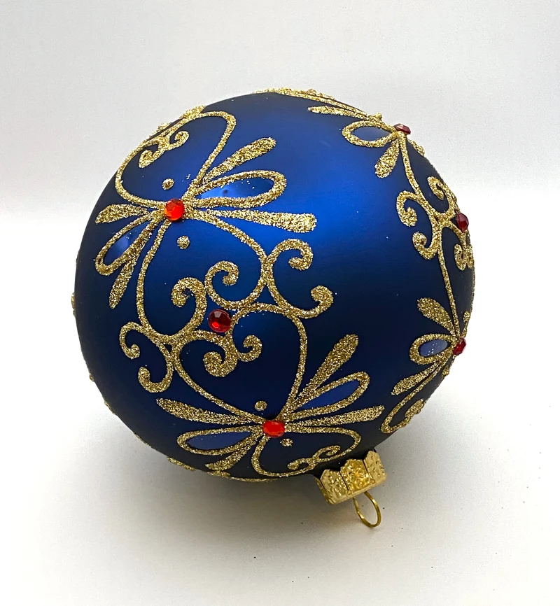 Kugel blau matt mit Golddekor und kleinen roten Steinen