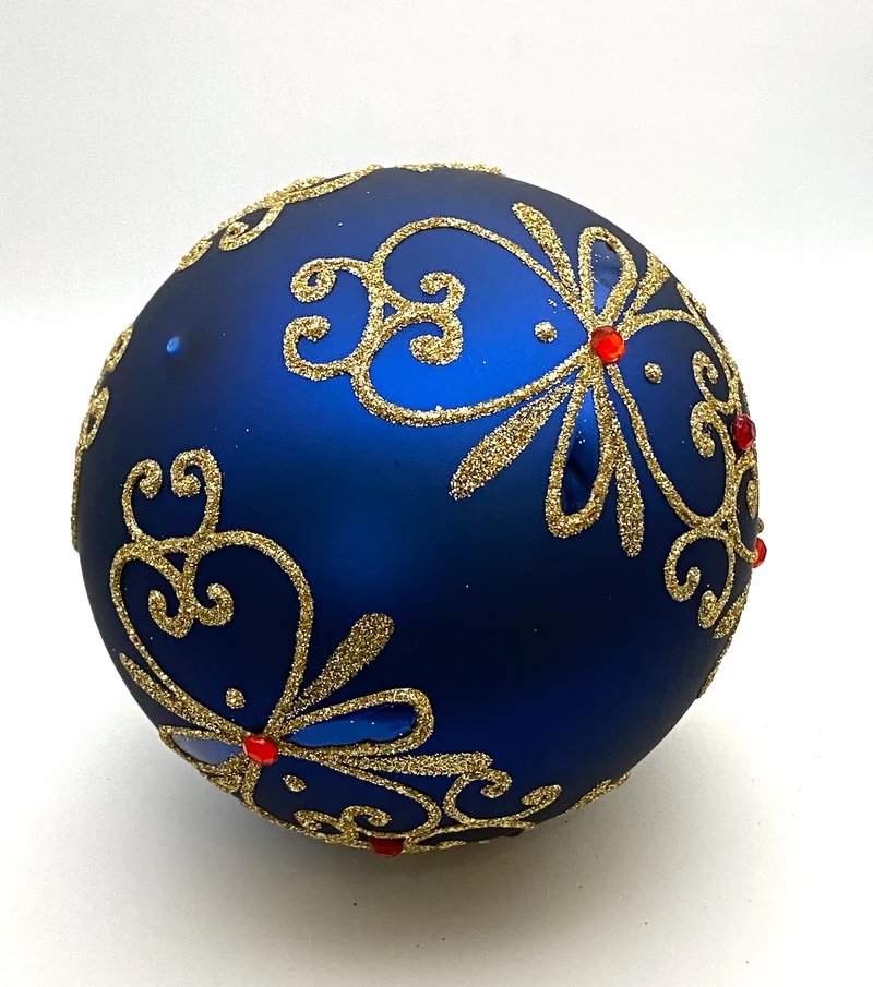 Kugel blau matt mit Golddekor und kleinen roten Steinen