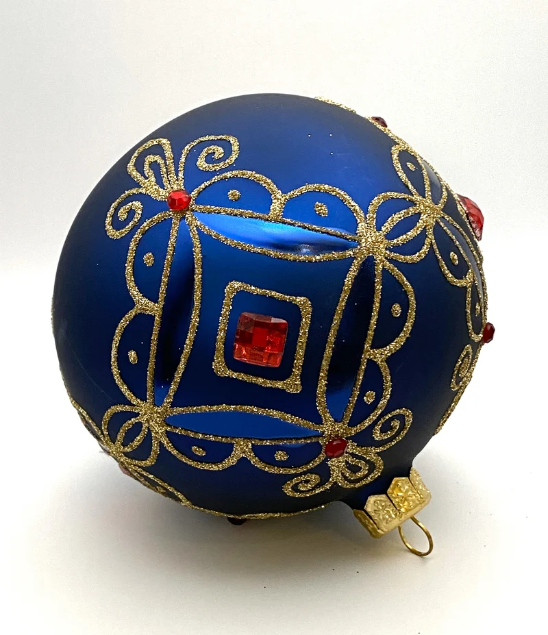 Kugel blau matt mit Golddekor, kleine und grosse rote Steine