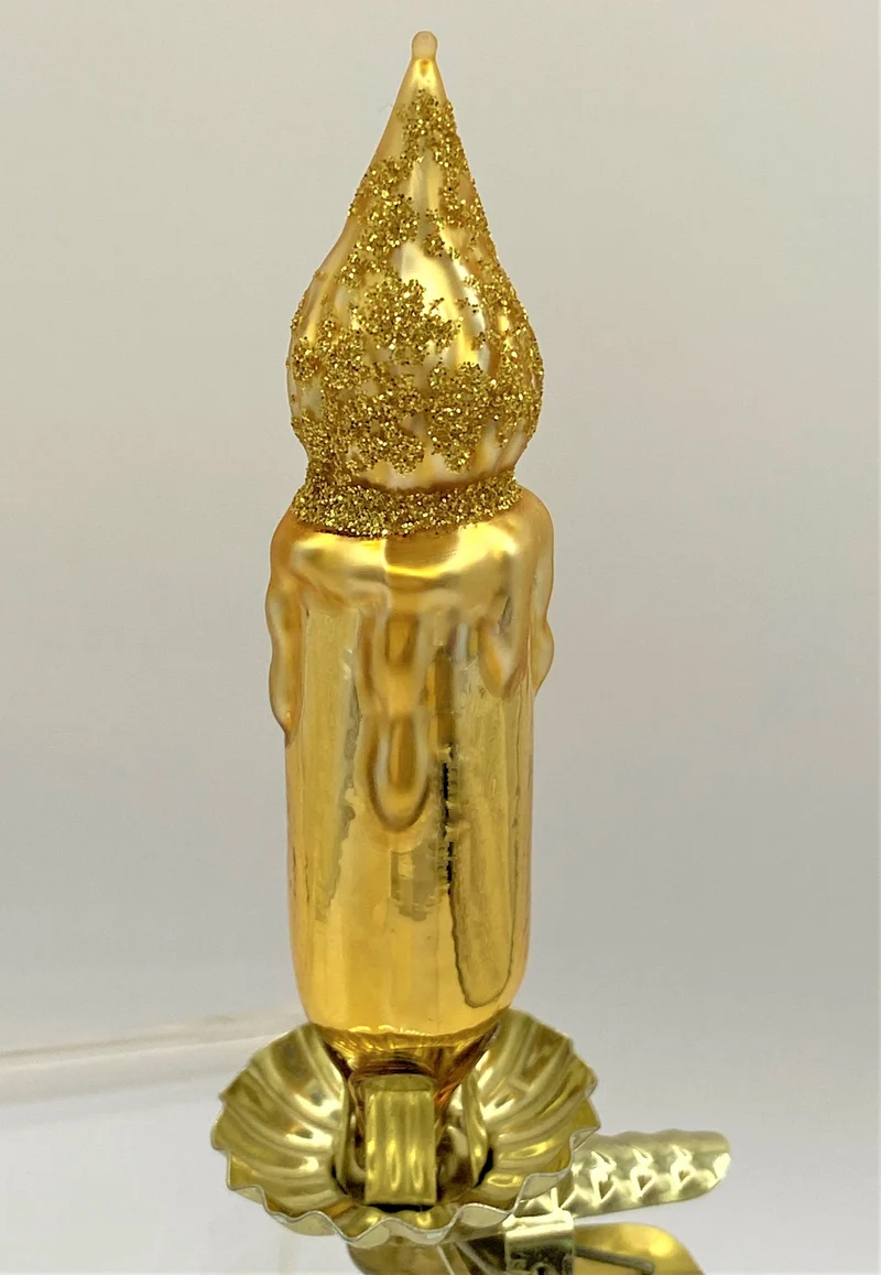 Goldene Kerze auf Clip