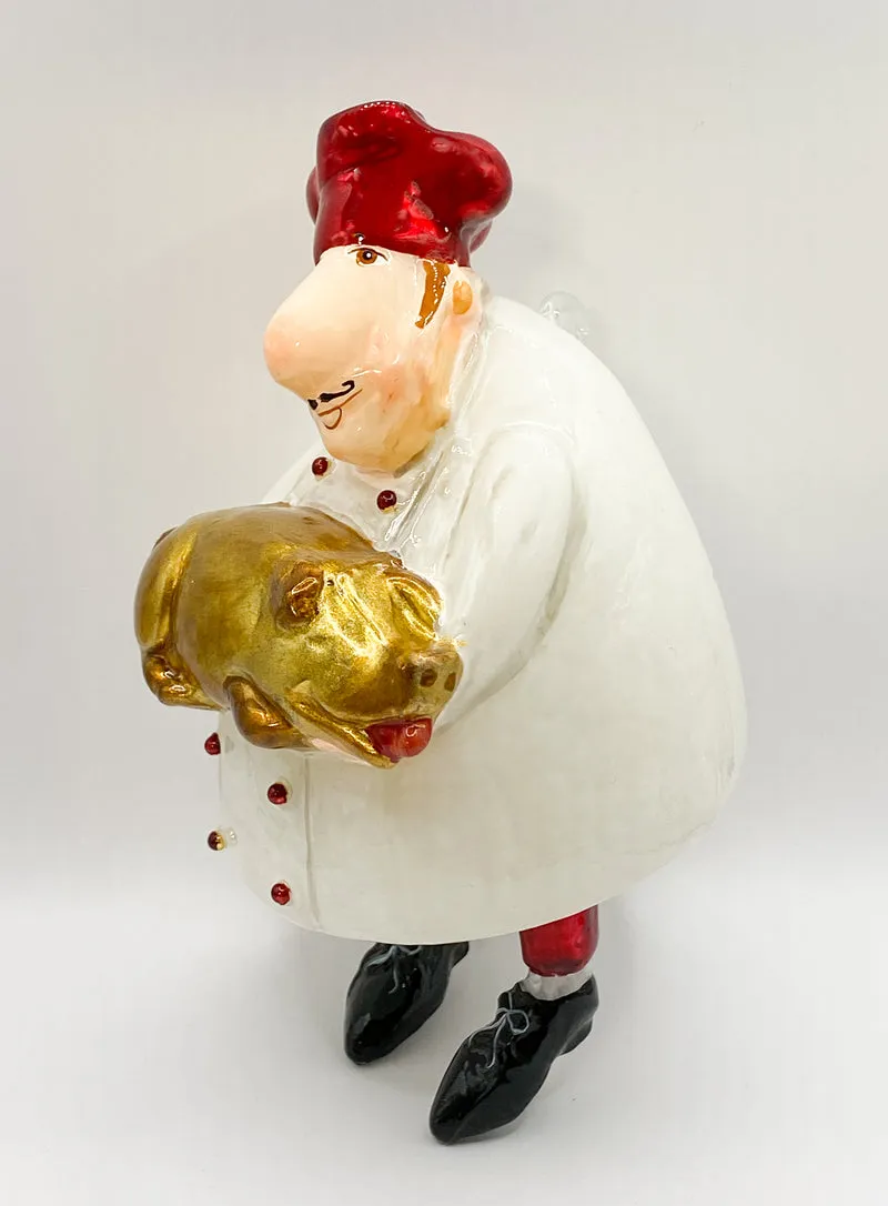 Koch mit Spanferkel, Karikatur, KOMOZJA MOSTOWSKI