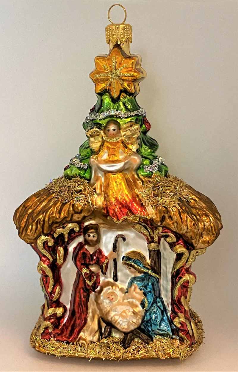 Heilige Familie in Krippe mit Engel und Stern