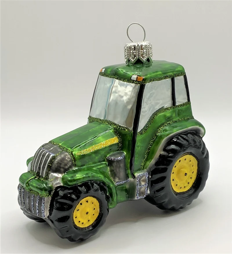 Grüner Traktor mit gelben Rädern