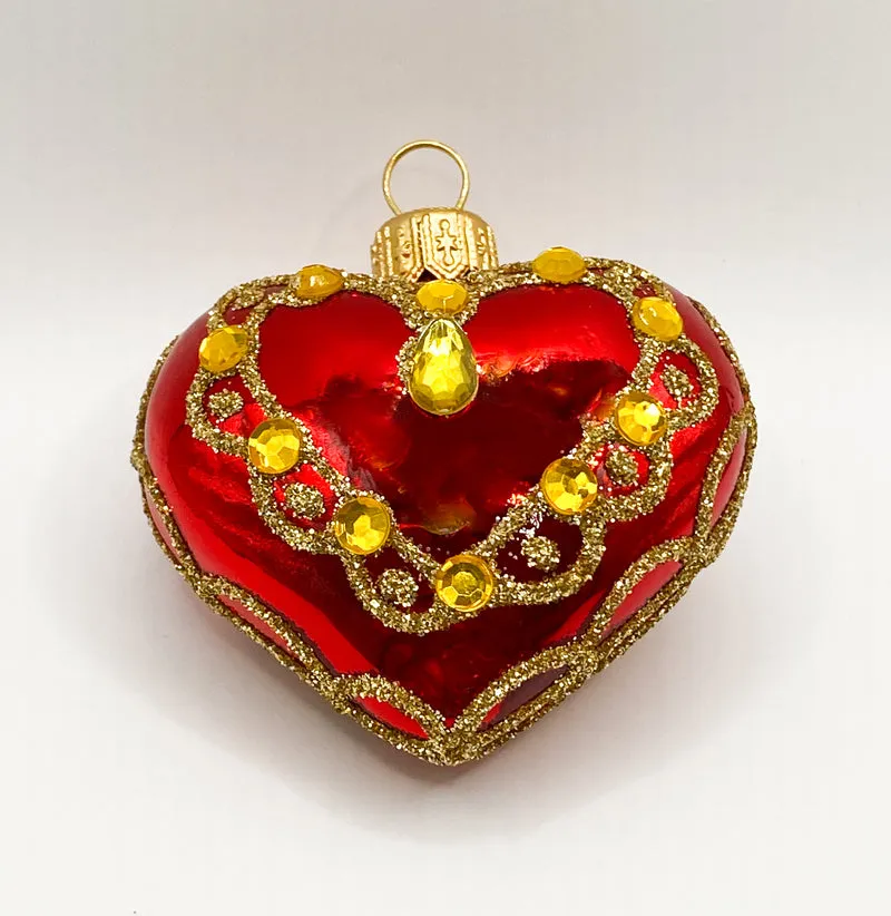 Rotes Herz mit goldenen Schmucksteinen