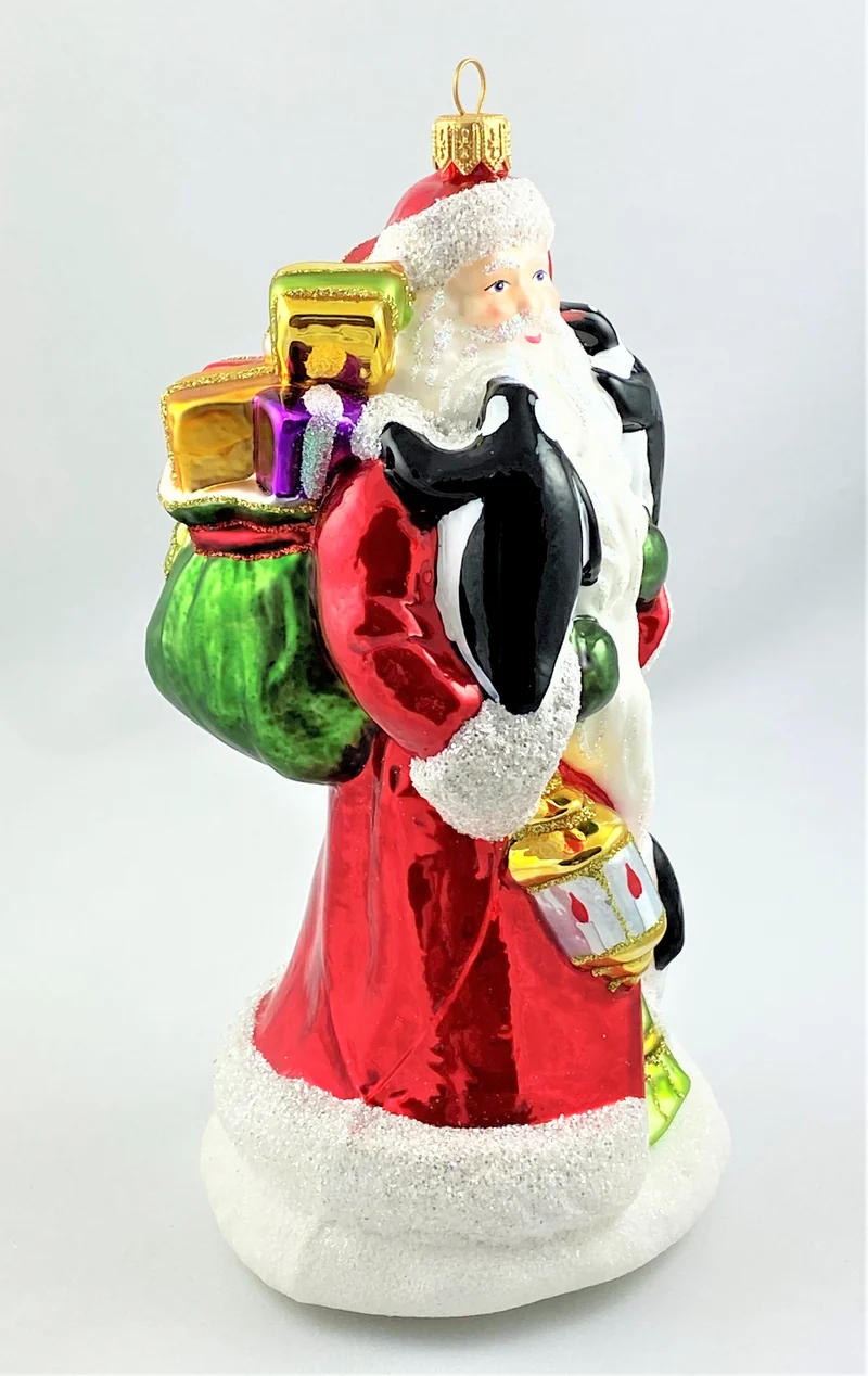 Weihnachtsmann bringt den Pinguinen die Weihnachtsgeschenke