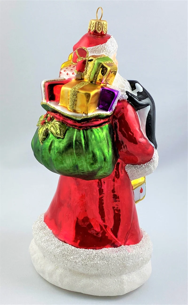 Weihnachtsmann bringt den Pinguinen die Weihnachtsgeschenke