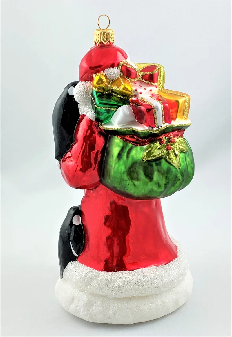 Weihnachtsmann bringt den Pinguinen die Weihnachtsgeschenke