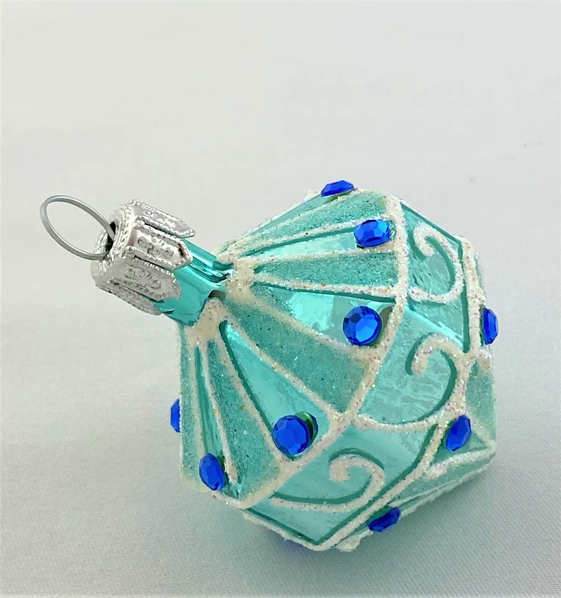 Türkisfarbenes Kreisel-Ornament mit blauen Schmucksteinen