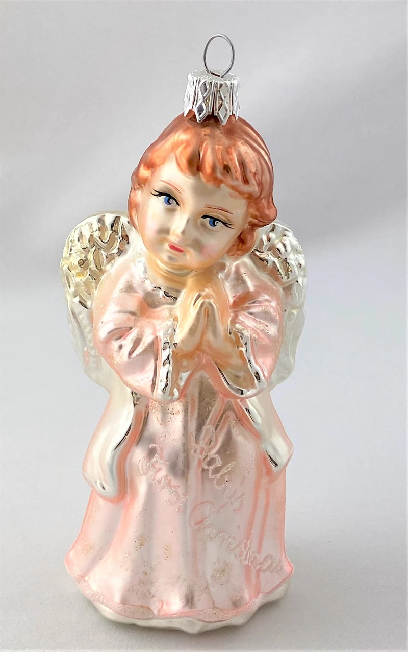 Engel im rosaroten Kleid mit der Aufschrift " Baby`s first Christmas "