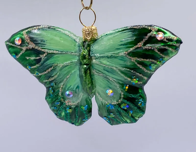 Grüner Schmetterling mit Schmucksteinen
