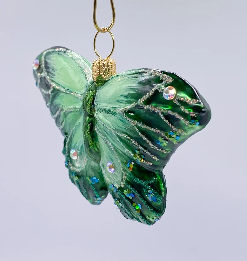 Grüner Schmetterling mit Schmucksteinen