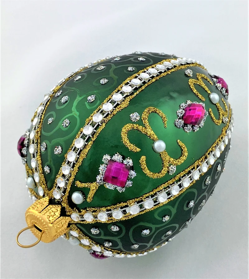 Faberge-Ei dunkelgrün mit weissen und violetten Strass-Steinen