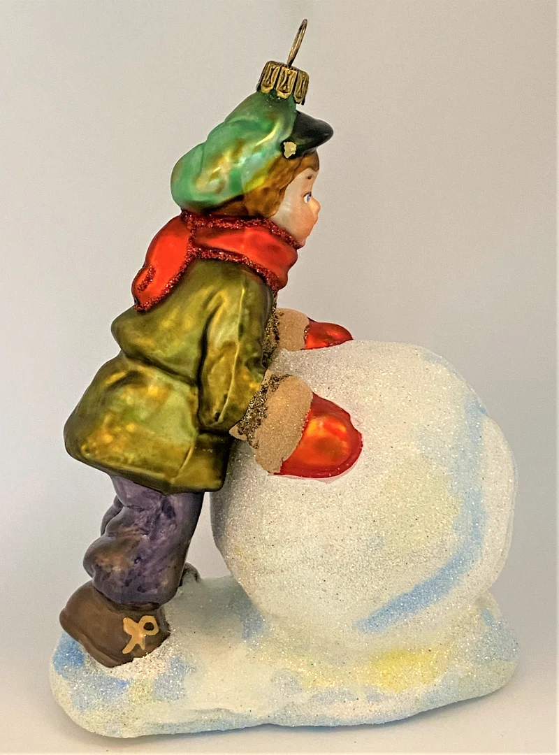 Der Junge will einen grossen Schneemann bauen , KOMOZJA MOSTOWSKI