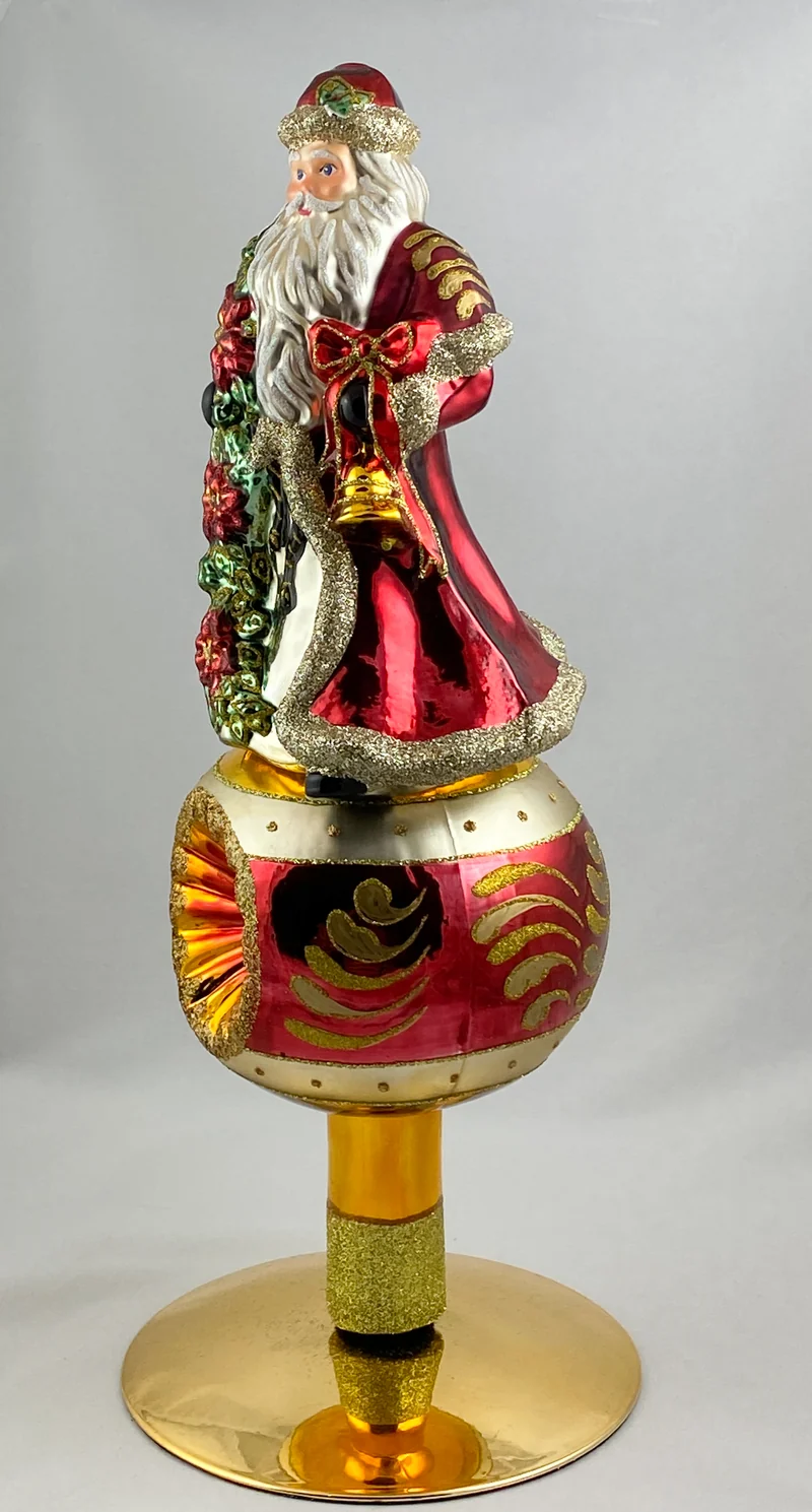 Christbaumspitze Santa mit Weihnachtsstern auf Reflexkugel