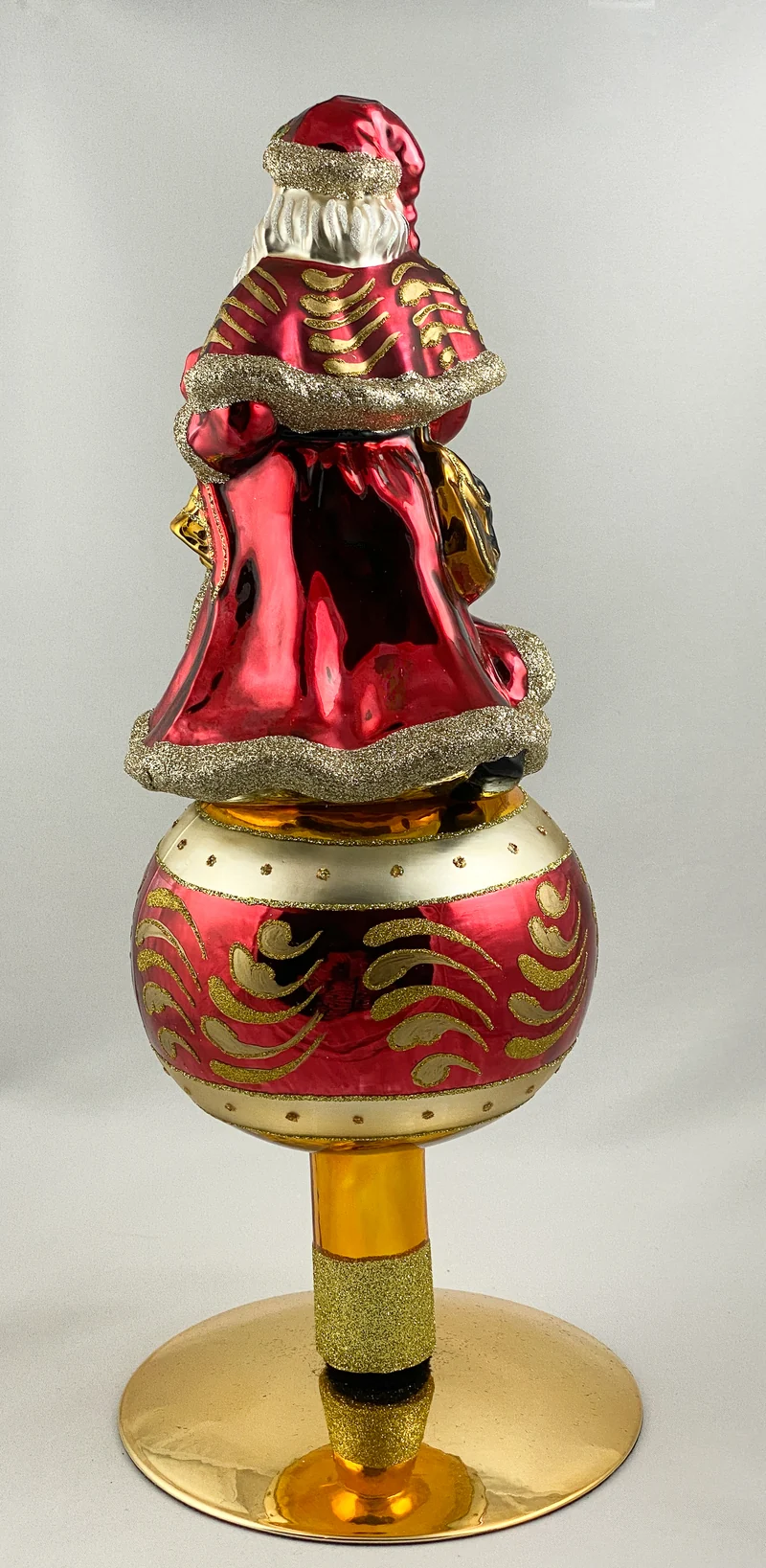 Christbaumspitze Santa mit Weihnachtsstern auf Reflexkugel