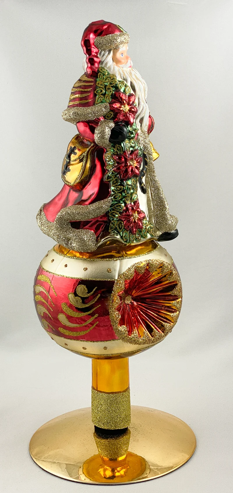 Christbaumspitze Santa mit Weihnachtsstern auf Reflexkugel