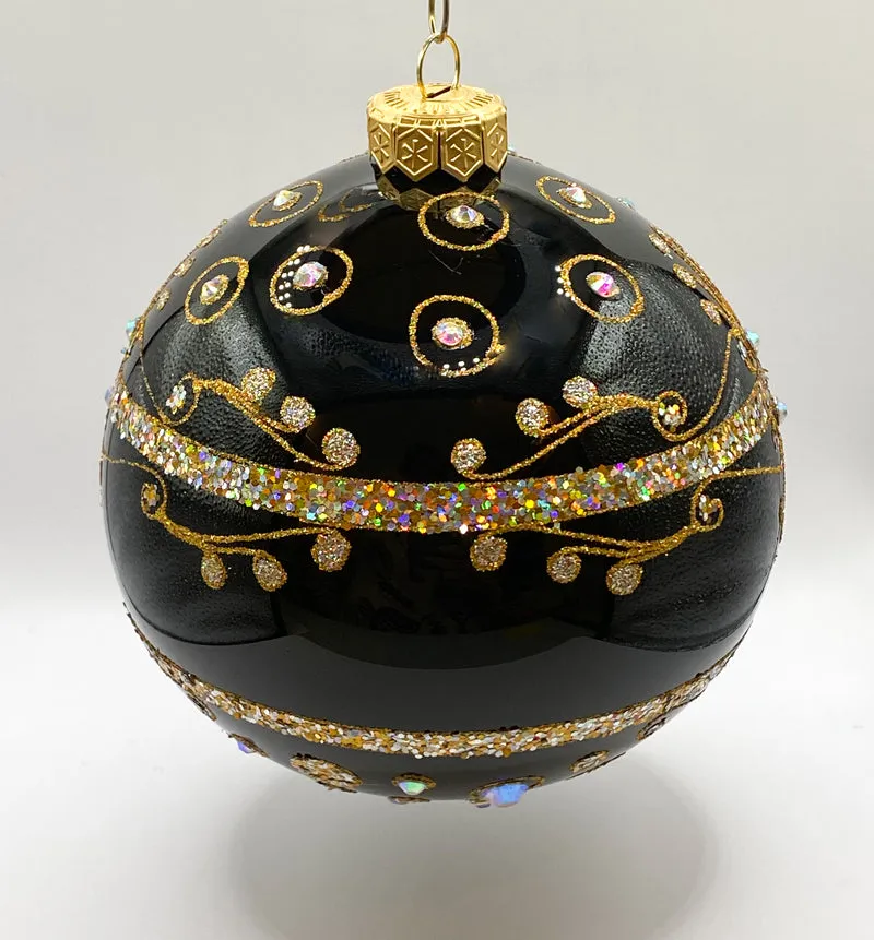 Schwarze Kugel mit goldenem Dekor und Schmucksteinen