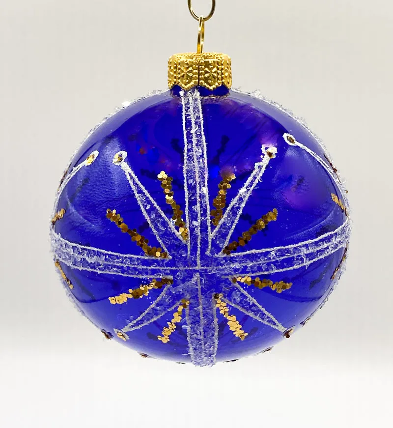 Transparente blaue Kugel mit weissem und goldenem Sternendekor