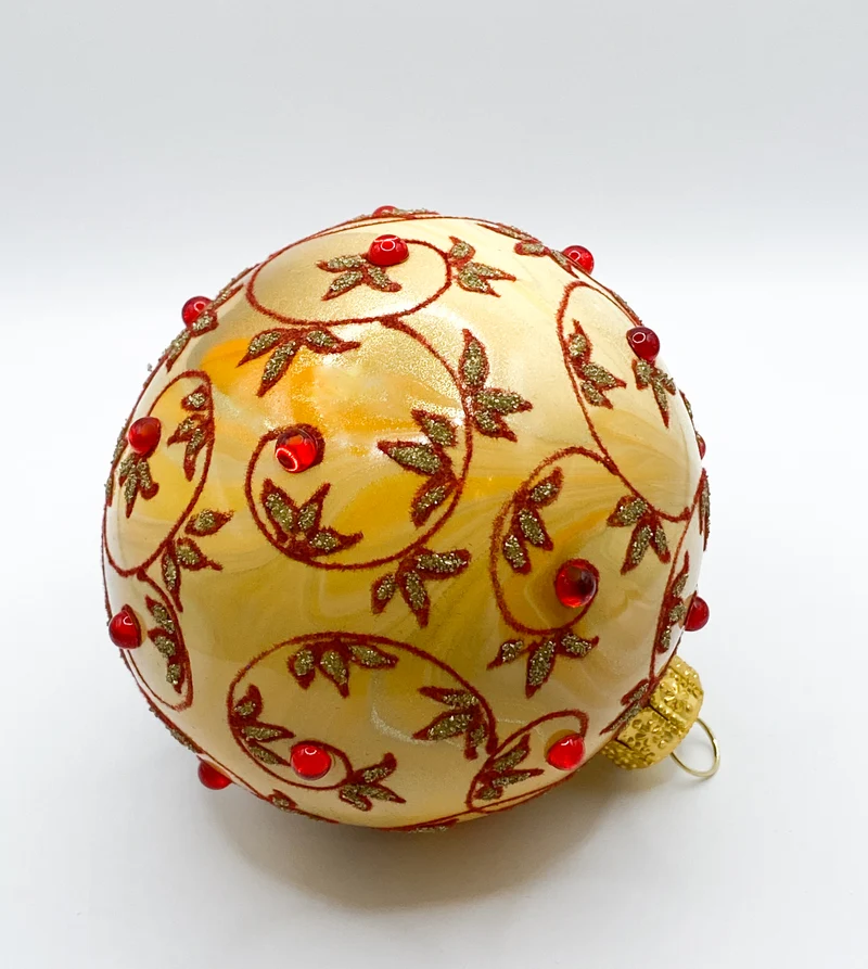 Kugel creme-orange marmoriert mit rotem Rankenmuster