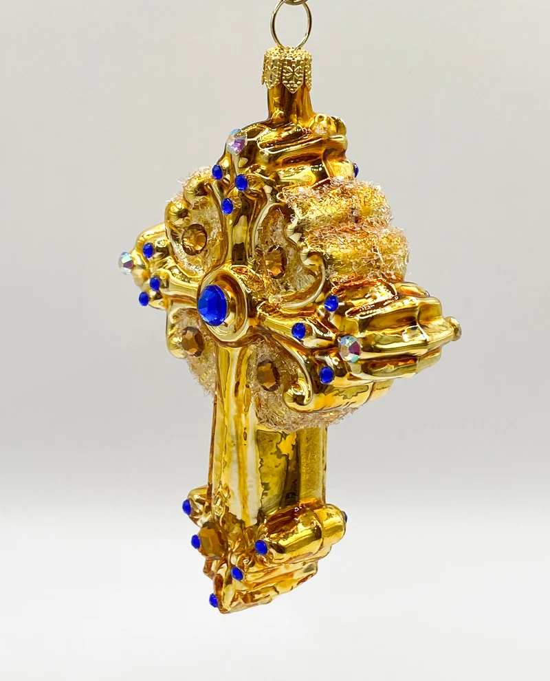 Kreuz goldfarben mit blauen und goldenen Schmucksteinen