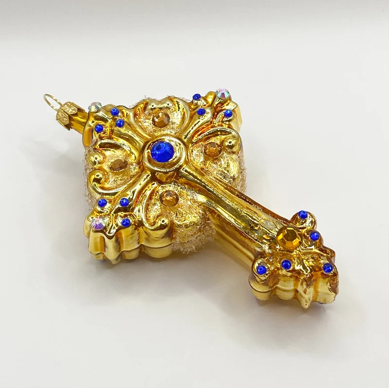 Kreuz goldfarben mit blauen und goldenen Schmucksteinen