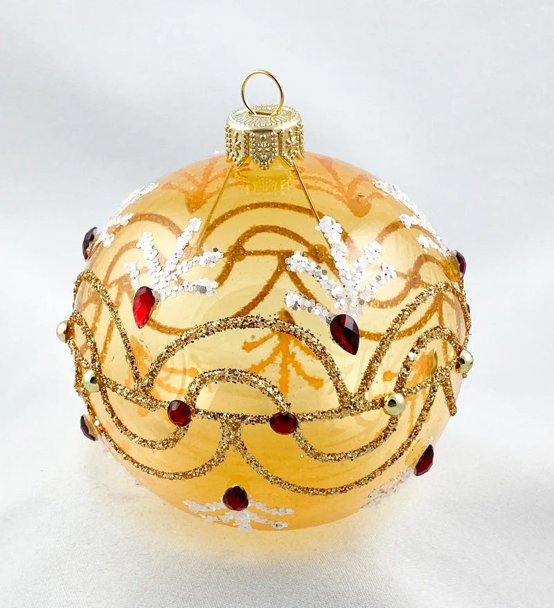 Kugel gold transparent mit Wellenmotiv und roten Steinen