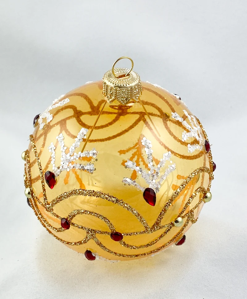 Kugel gold transparent mit Wellenmotiv und roten Steinen