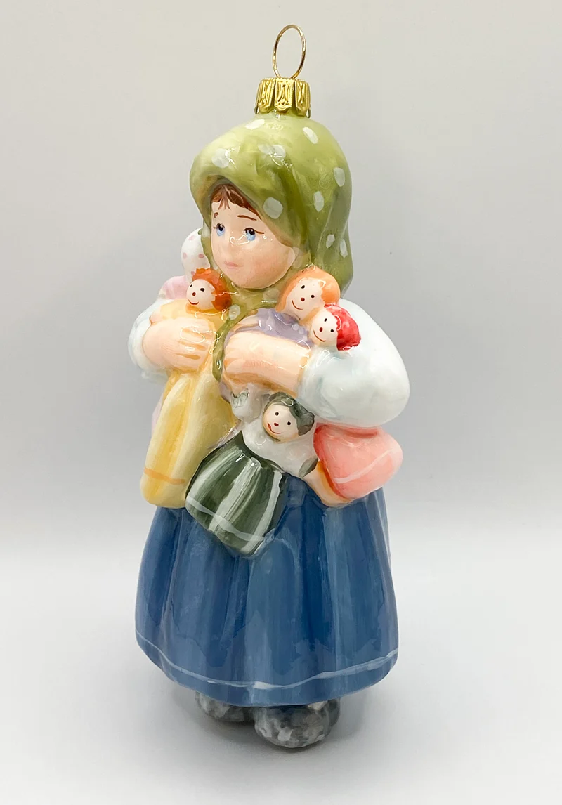 Das Mädchen spielt mit vielen Puppen, KOMOZJA MOSTOWSKI