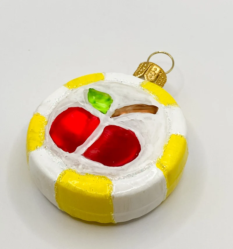 Bunter Bonbon mit rotem Apfel-Motiv