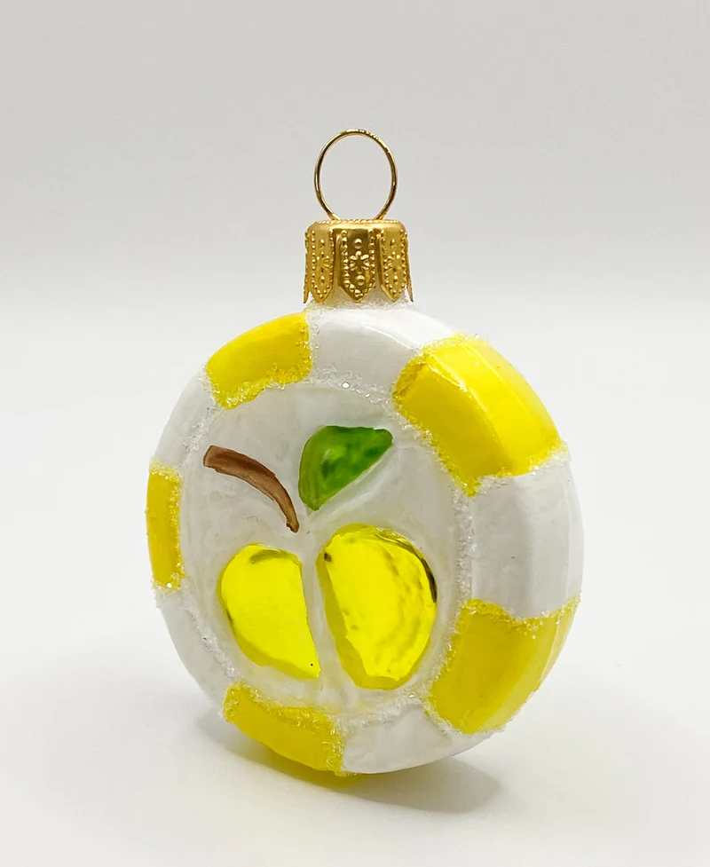 Gelber Bonbon mit Apfel-Motiv