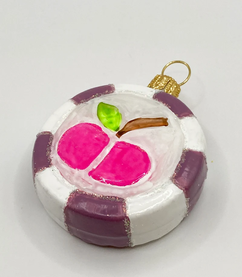 Bonbon mit pinkem Apfel-Motiv