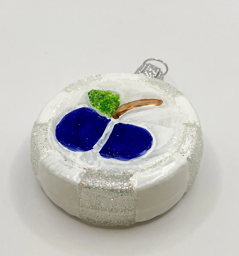 Weisser Bonbon mit Apfel-Motiv