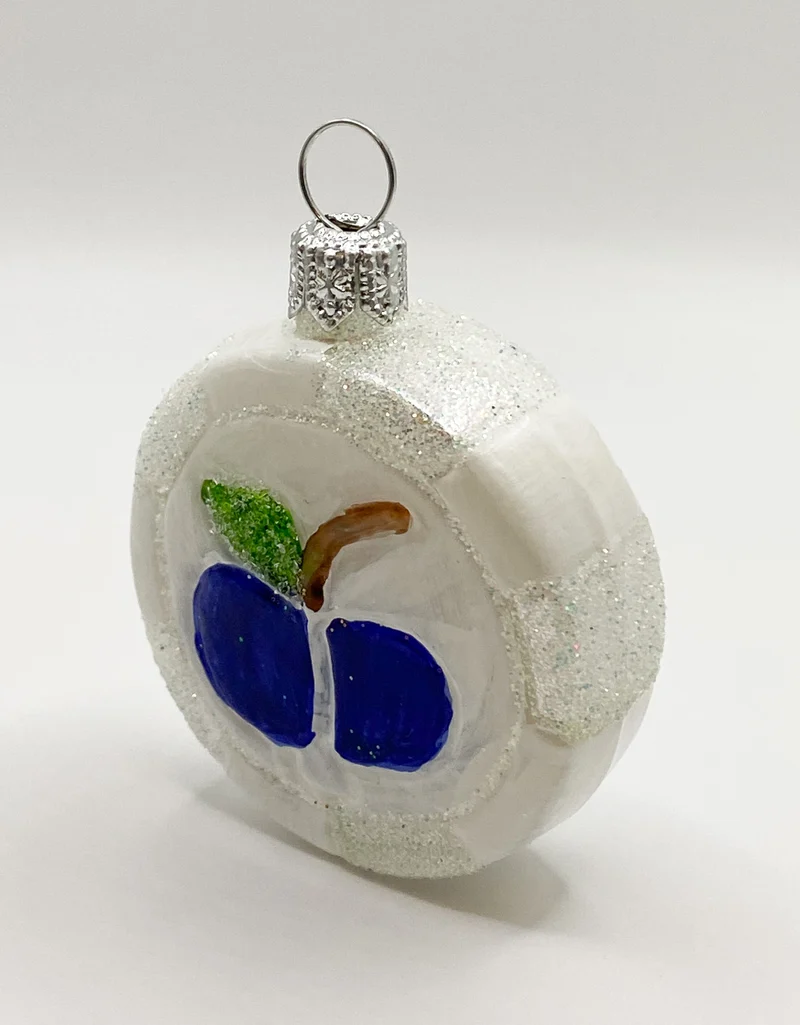 Weisser Bonbon mit Apfel-Motiv