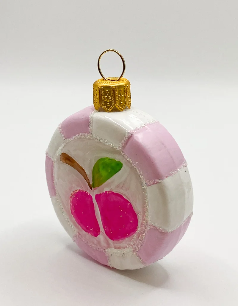 Rosa Bonbon mit Apfel-Motiv