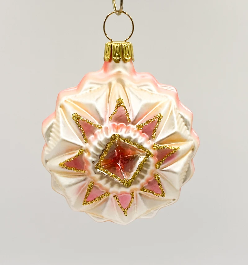 Medaillon mit stilisiertem rosa Stern