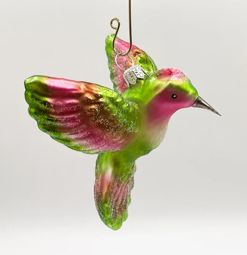 Kolibri fliegend grün und pink