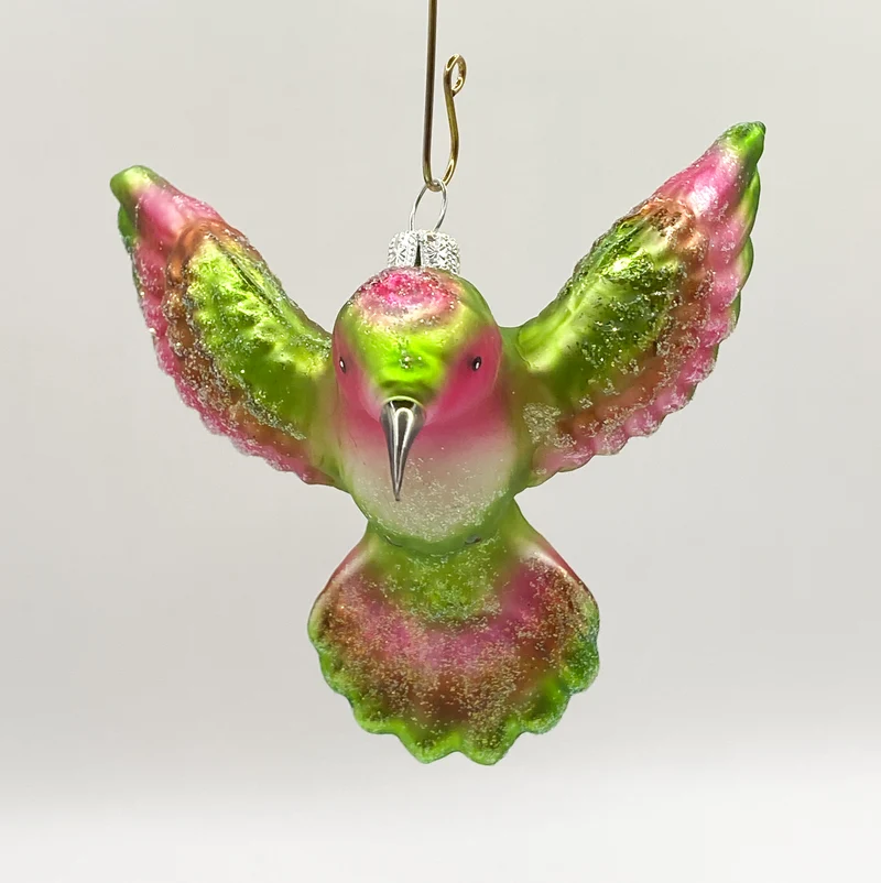 Kolibri fliegend grün und pink