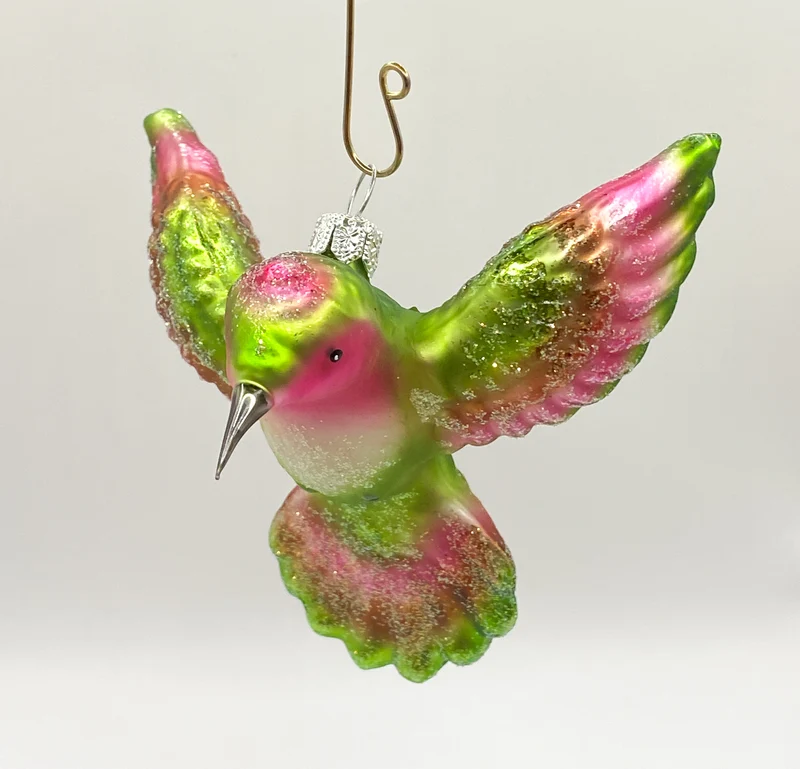 Kolibri fliegend grün und pink