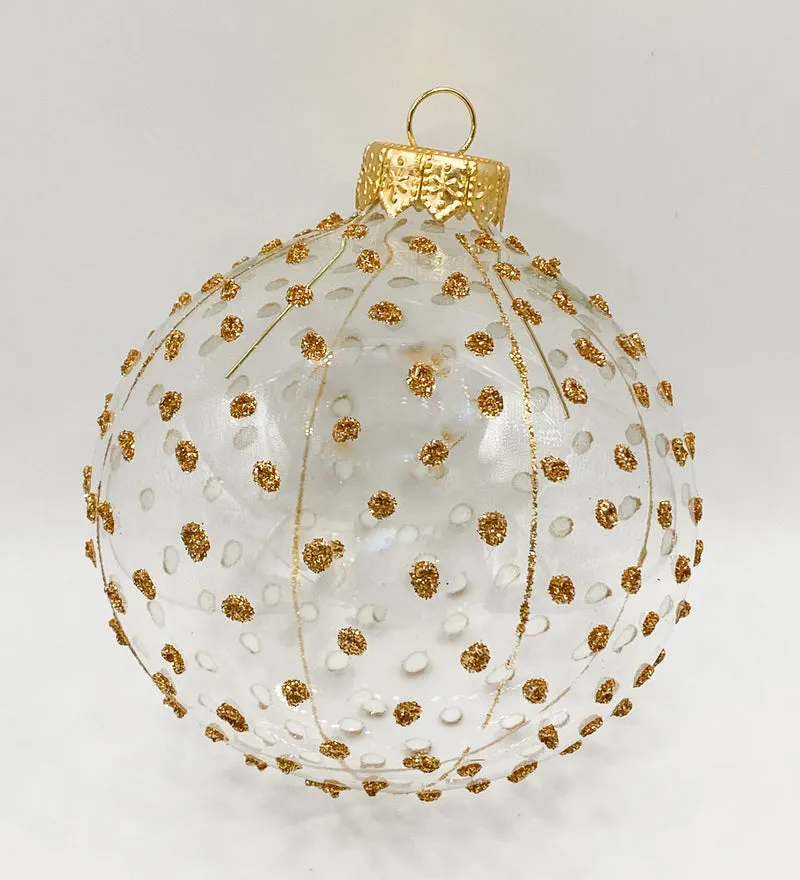 Transparente Kugel mit goldenen Glitzer-Tupfen