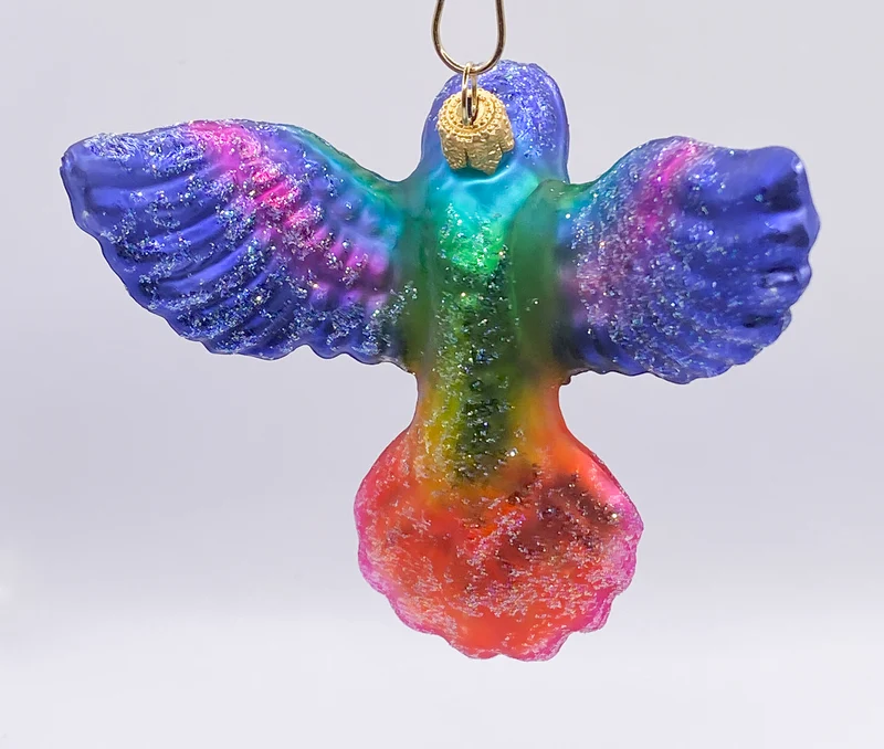Regenbogen farbener fliegender Kolibri