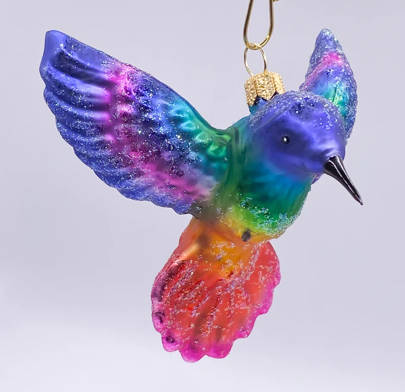 Regenbogen farbener fliegender Kolibri