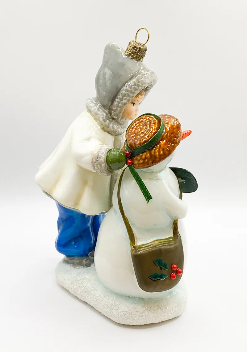 Das Kind gibt dem Schneemann seinen Strohhut, AtlasArt
