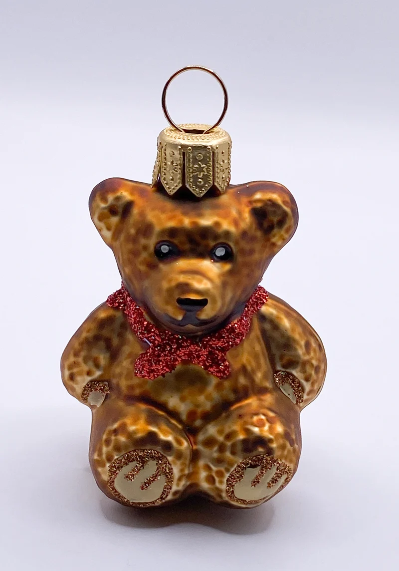 Sitzender Teddybär mit roter Schleife