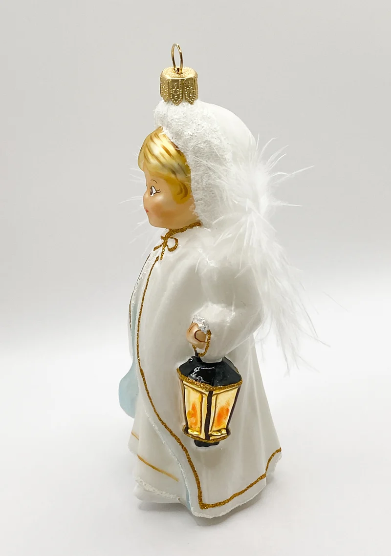 Das Christkind leuchtet mit der Laterne