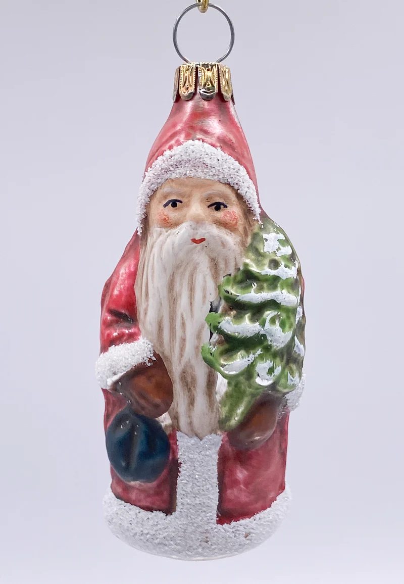 Weihnachtsmann mit Rucksack und Baum