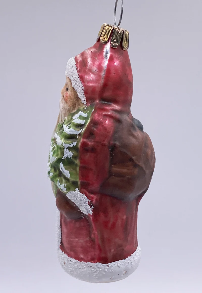 Weihnachtsmann mit Rucksack und Baum