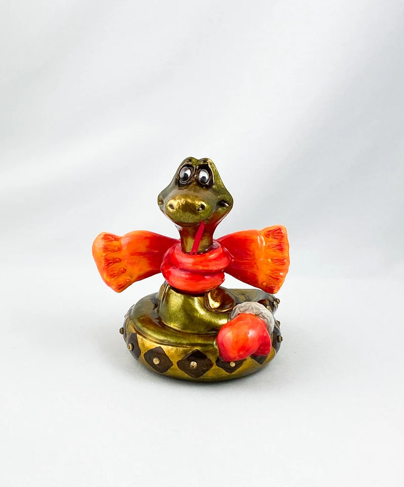 Schlange mit orangem Schal, AtlasArt