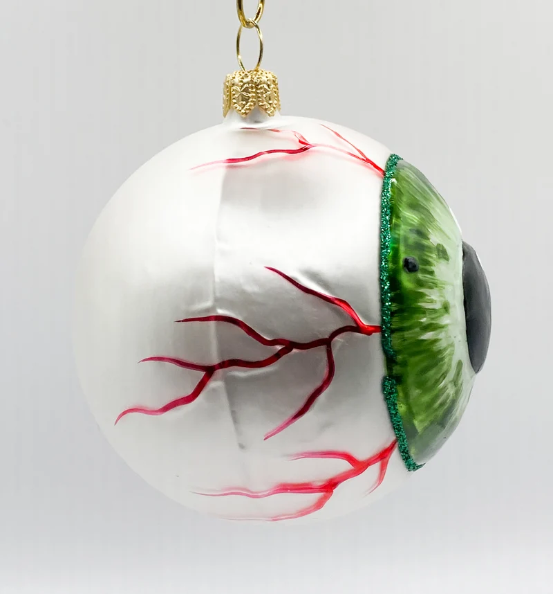 Anatomisches Auge mit grüner Iris und runder Pupille